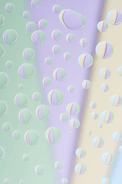 Close-up view of transparent water drops on light abstract background — Stock Photo