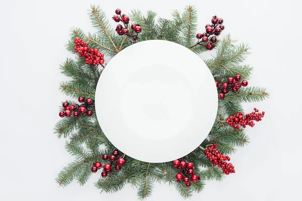 Top view of pine tree wreath with Christmas decorations and round blank space in middle isolated on white — Stock Photo