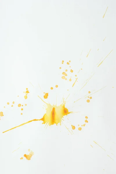 Abstract bright orange watercolor splatters on paper background — Stock Photo