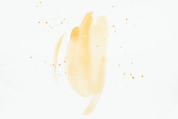 Orange watercolor strokes with splatters on white paper — Stock Photo