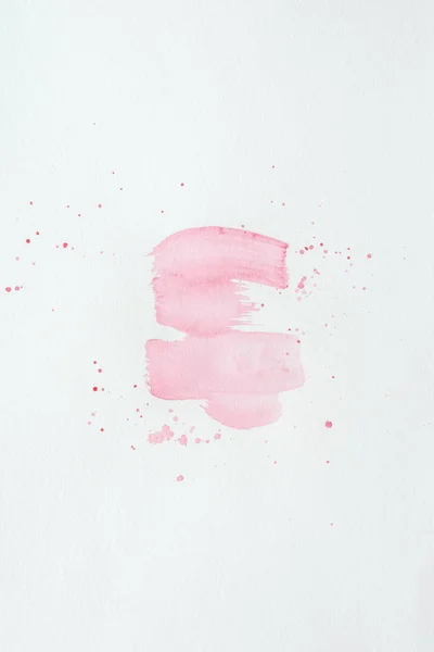 Abstract light pink watercolor strokes with splatters on white paper — Stock Photo