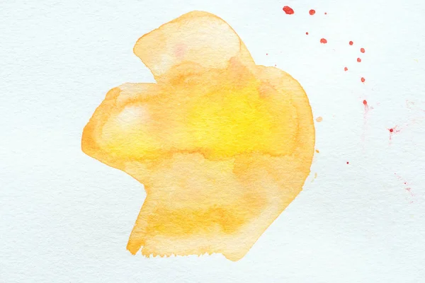 Peinture abstraite à l'aquarelle orange et jaune sur papier blanc — Photo de stock