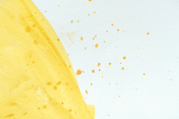 Abstract close up background with yellow watercolor stroke with splatters — Stock Photo