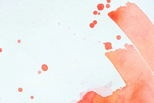 Creative background with red watercolor strokes and splatters on white paper — Stock Photo