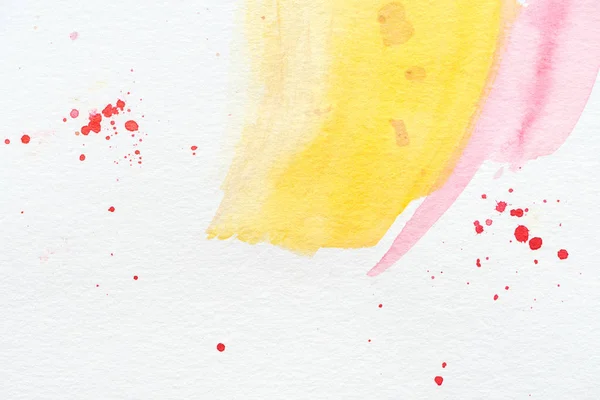 Abstract background with yellow and pink watercolor strokes with red splatters — Stock Photo