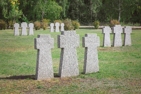 Graveyard with identical old memorial headstones placed in rows — Stock Photo