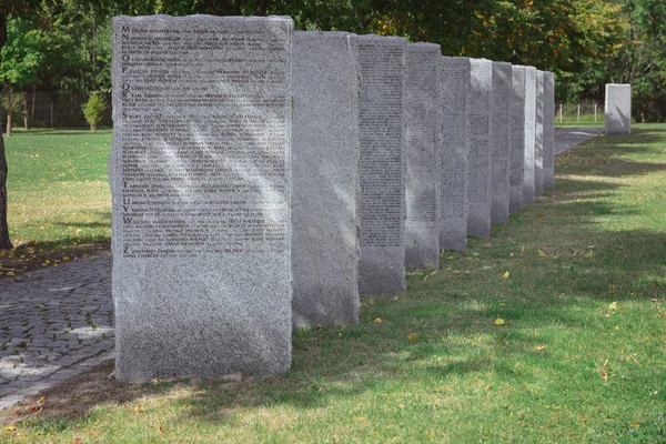 Old memorial gravestones with lettering at cemetery — Stock Photo