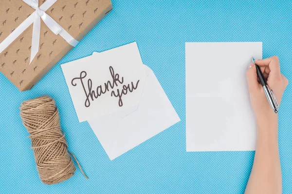 White postcard with thank you lettering and blank sheet isolated on blue background — Stock Photo