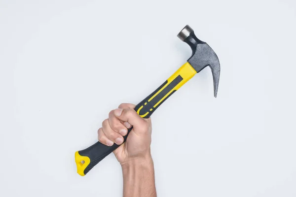 Cropped shot of man holding hammer with rubber handle isolated on white — Stock Photo