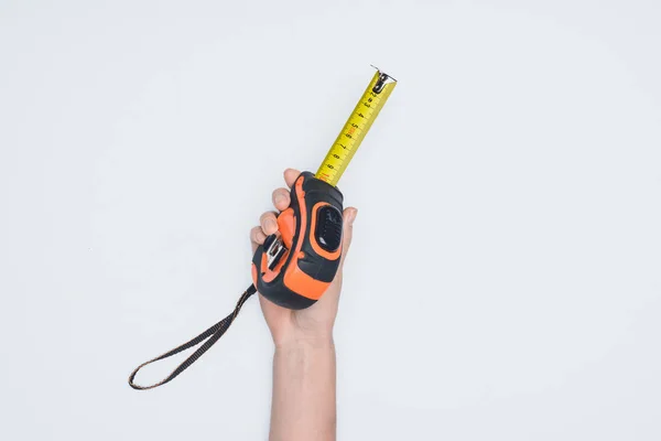 Cropped shot of woman holding measuring tape tool isolated on white — Stock Photo