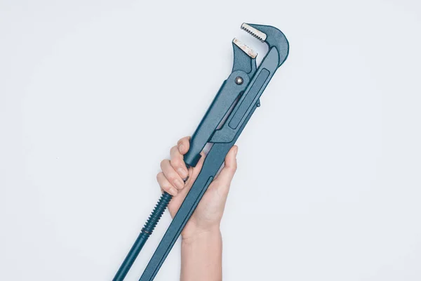 Cropped shot of woman holding plumber wrench isolated on white — Stock Photo