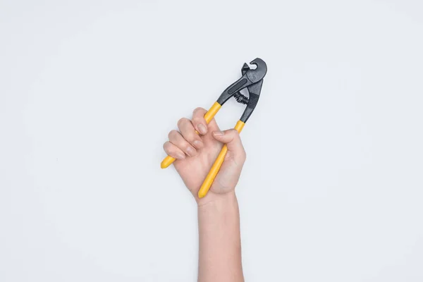 Cropped shot of woman holding wire pliers isolated on white — Stock Photo