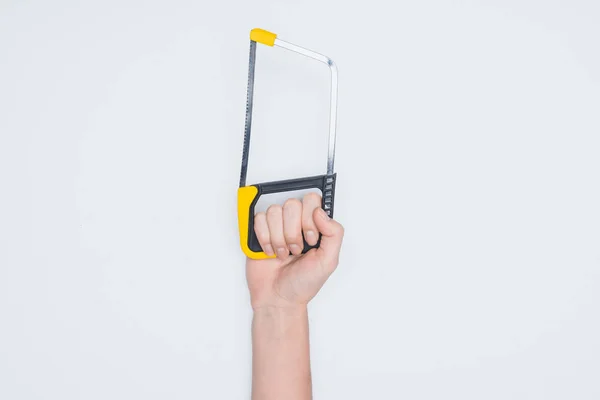 Cropped shot of woman holding fretsaw isolated on white — Stock Photo