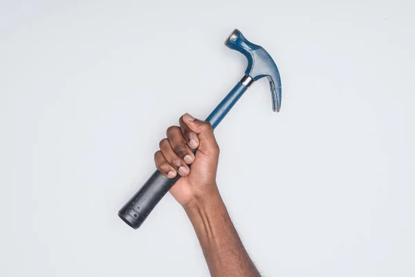 Cropped shot of african american man holding sssss isolated on white — Stock Photo