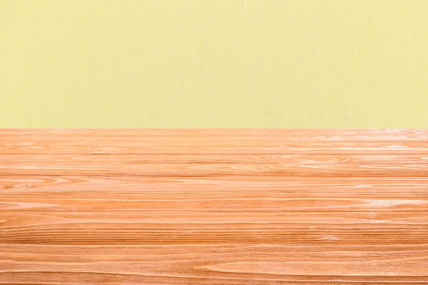 Template of orange wooden floor with yellow background — Stock Photo