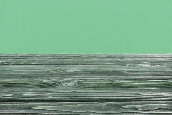 Plantilla de suelo de madera verde oscuro sobre fondo verde - foto de stock