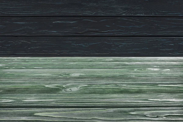 Template of dark green wooden floor on black planks background — Stock Photo