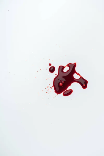 Top view of white surface with blood blot — Stock Photo