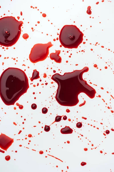 Top view of messy blood droplets on white surface — Stock Photo