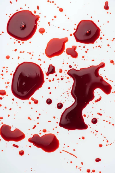 Top view of messy blood droplets on white tabletop — Stock Photo