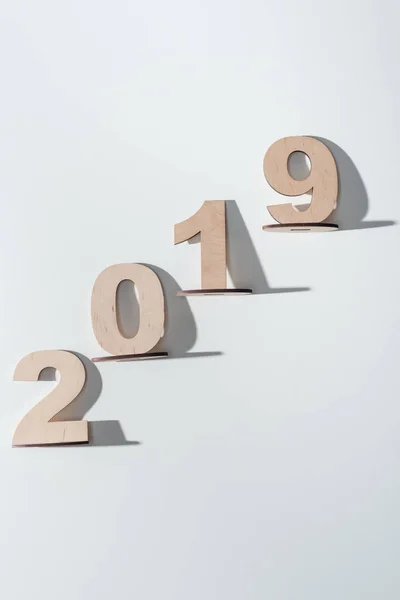 Top view of 2019 date made of wooden numbers on white background — Stock Photo