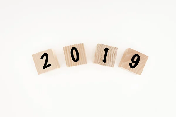 Top view of 2019 date made of wooden blocks isolated on white — Stock Photo