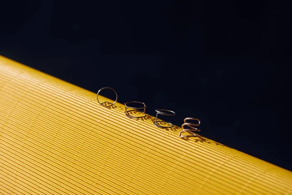 Beautiful luxury rings on yellow and black striped surface — Stock Photo