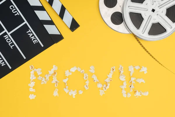 Clapperboard, bobine di film e lettering 