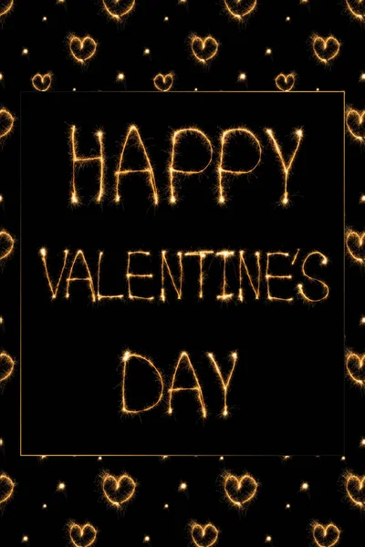 Close up view of happy valentines day light lettering and hearts on black background, st valentines day concept — Stock Photo