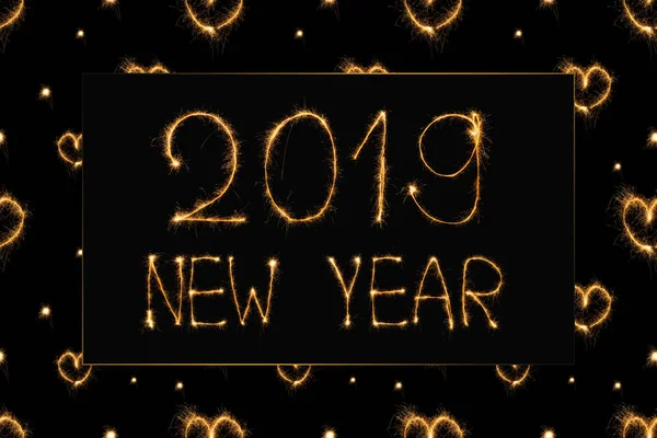 2019 new year light lettering and hearts light signs on black background — Stock Photo