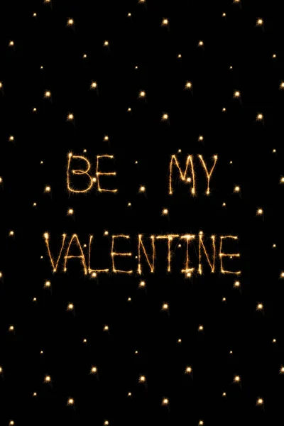 Close up view of be my valentine light lettering on black background, st valentines day concept — Stock Photo