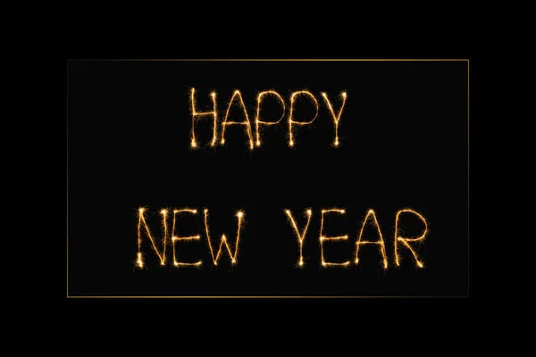 Vista de cerca de feliz año nuevo letras de luz sobre fondo negro - foto de stock