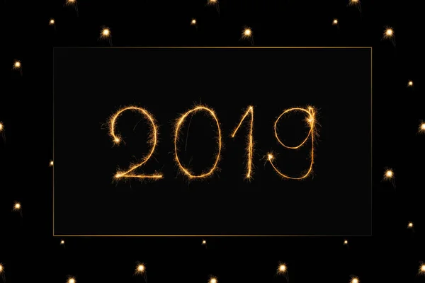 Close up view of 2019 light sign on black background — Stock Photo