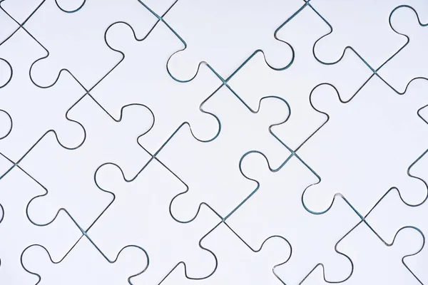 Full frame of arranged white puzzles background — Stock Photo