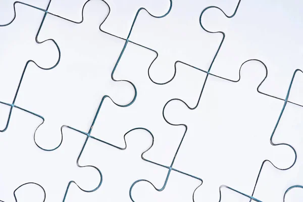 Cornice completa di puzzle bianchi disposti sfondo — Foto stock