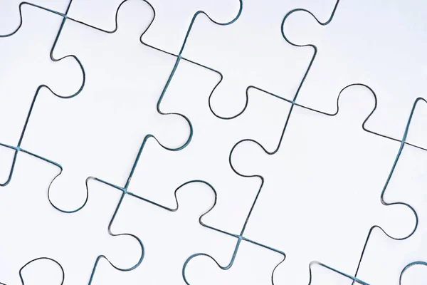 Full frame of arranged white puzzles backdrop — Stock Photo