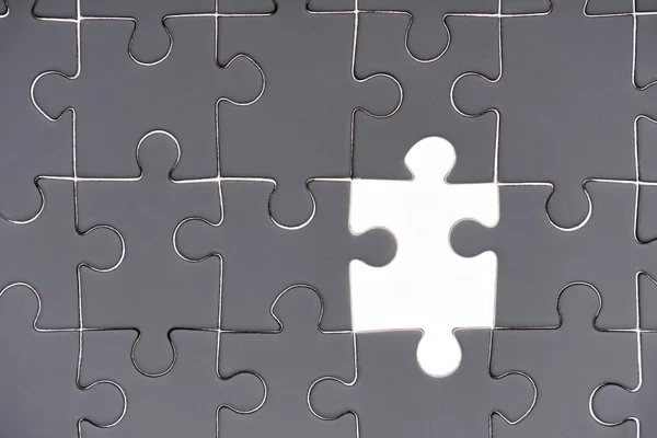 Full frame of grey and white puzzle pieces background — Stock Photo