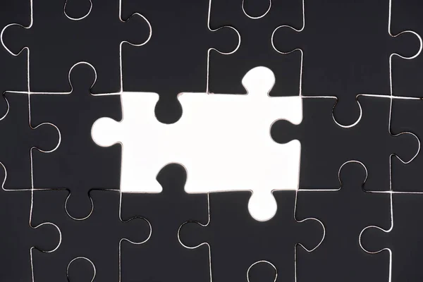 Full frame of black and white puzzles backdrop — Stock Photo