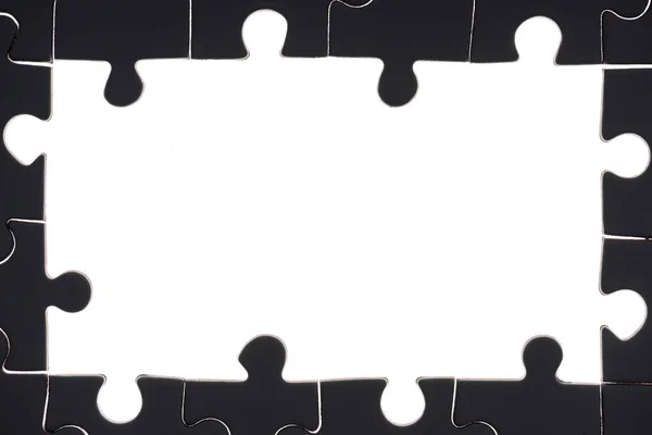 Full frame of black and white puzzles backdrop — Stock Photo