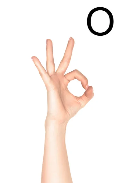 Vista recortada de la mano femenina que muestra letra cirílica, lenguaje sordo y mudo, aislado en blanco - foto de stock