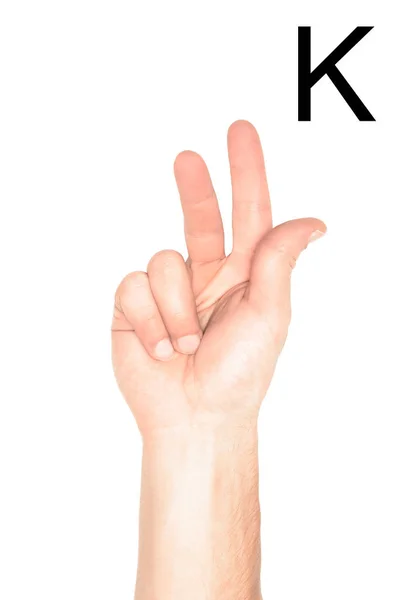 Vista parcial de la mano que muestra la letra latina - K, lenguaje sordo y mudo, aislado en blanco - foto de stock
