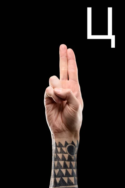 Tattooed hand showing cyrillic letter, sign language, isolated on black — Stock Photo