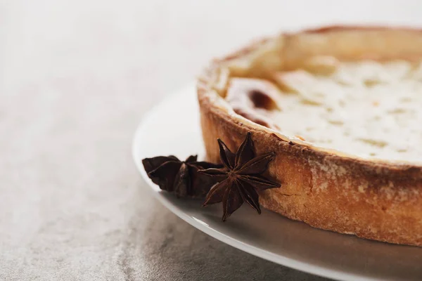 Delicious sweet flan cake with star anise on plate — Stock Photo