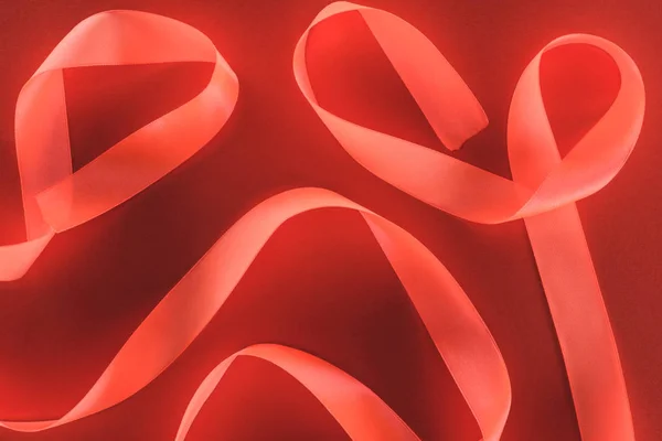 Top view of red festive ribbon isolated on red, st valentine day concept — Stock Photo