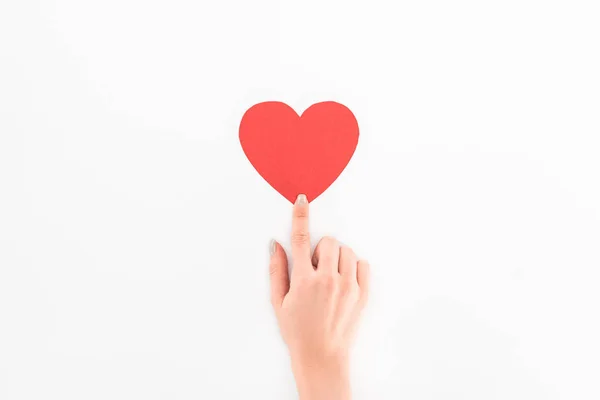 Cropped shot of woman pointing at red heart symbol isolated on white, st valentine day concept — Stock Photo