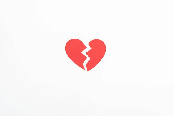 Elevated view of broken red heart symbol isolated on white, st valentine day concept — Stock Photo