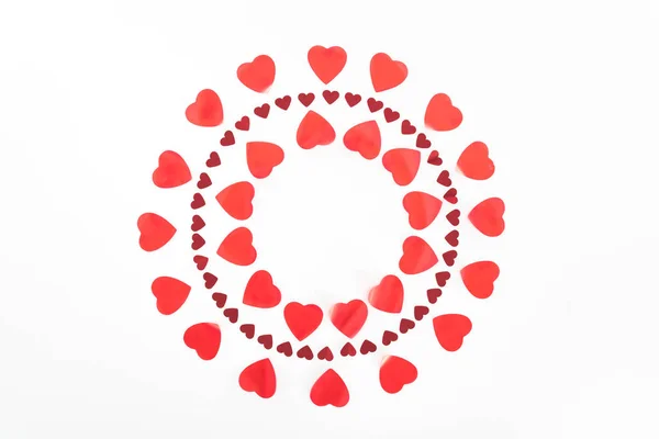 Top view of circles made of red heart symbols isolated on white, st valentine day concept — Stock Photo