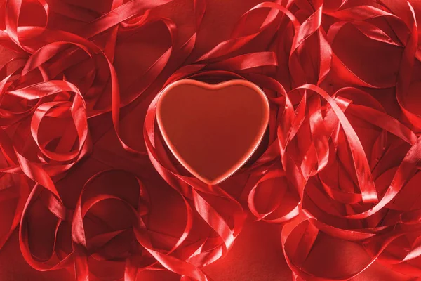 Close-up view of beautiful red heart and decorative ribbons, valentines day background — Stock Photo