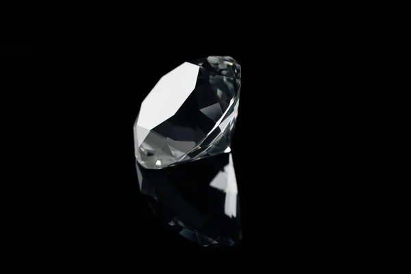 Pure shiny diamond with reflection isolated on black — Stock Photo