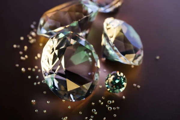 Selective focus of clear diamonds on brown background — Stock Photo